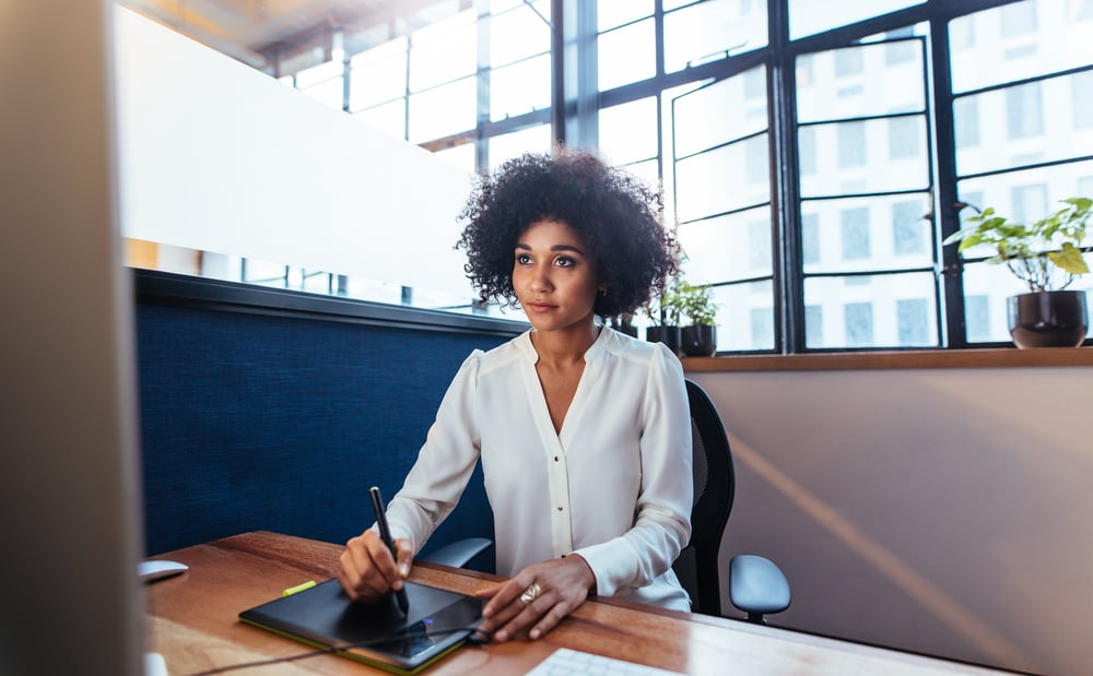 Woman designing using tablet