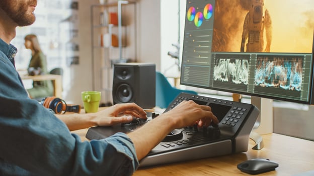 Image of man editing a movie